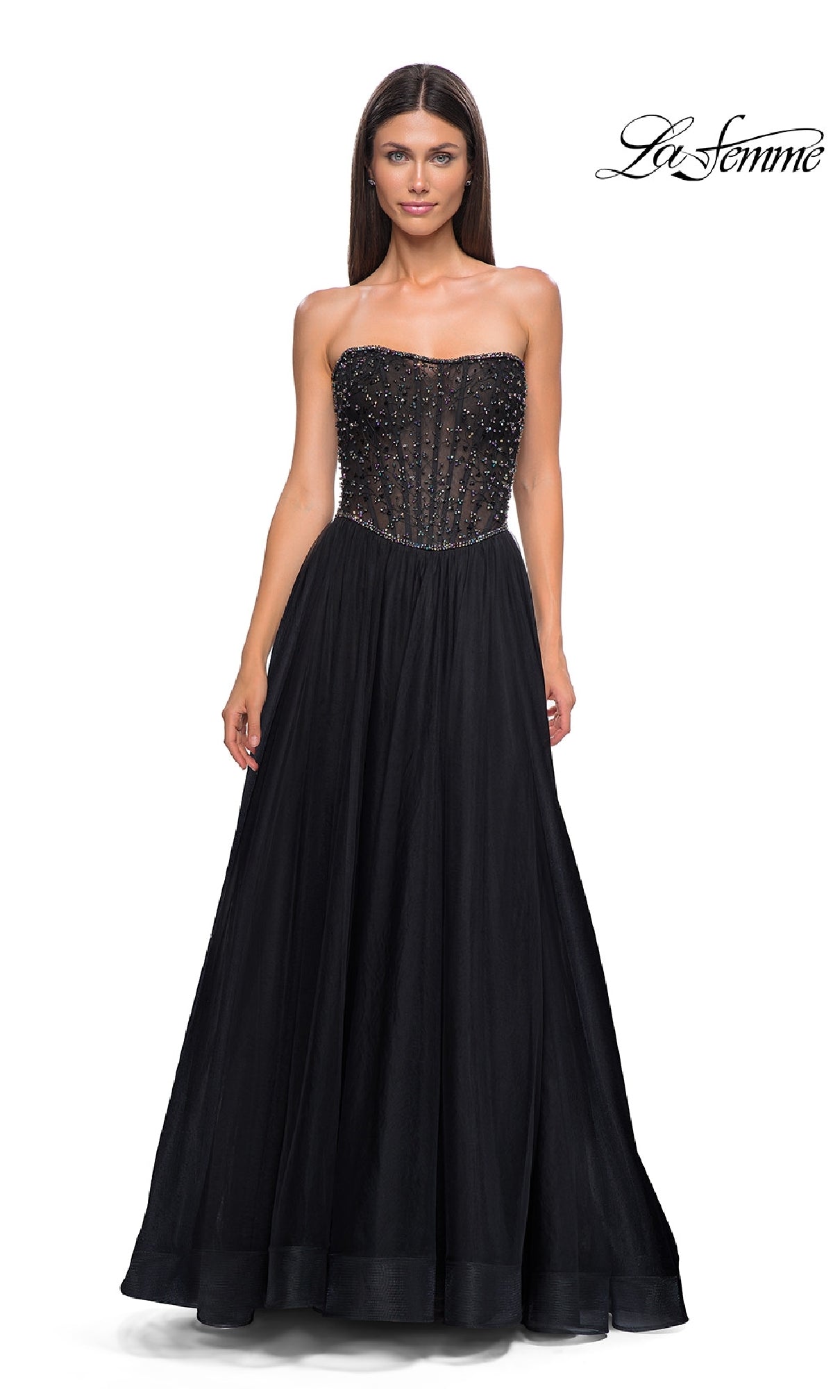 A woman stands facing forward in the Strapless Long Black Prom Ball Gown: La Femme 32856, featuring a fitted beaded bodice and flowing skirt. The La Femme logo appears in the top right corner.